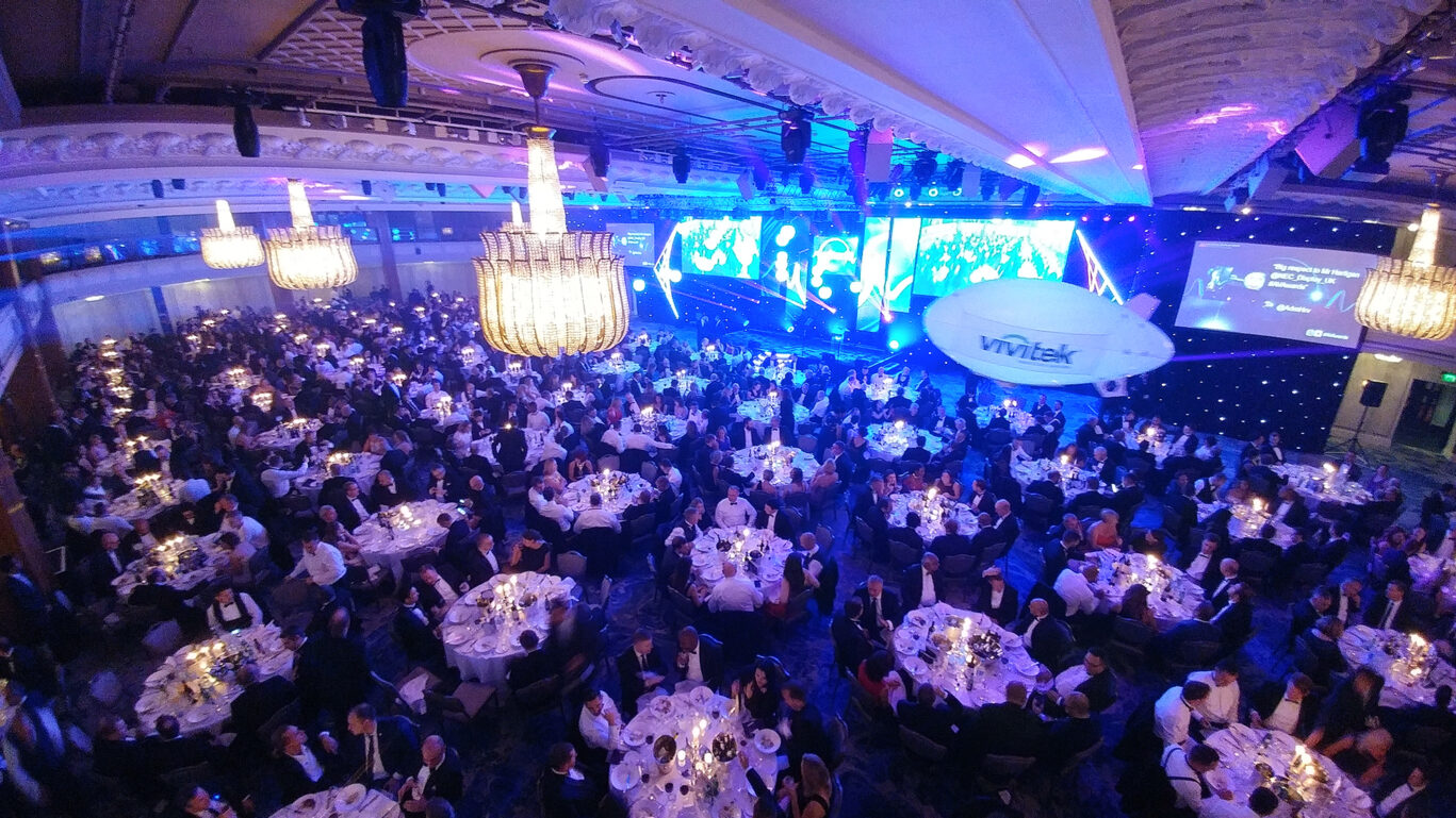 View across the AV Awards 2017 venue showing the audience and illuminated presentation stage.