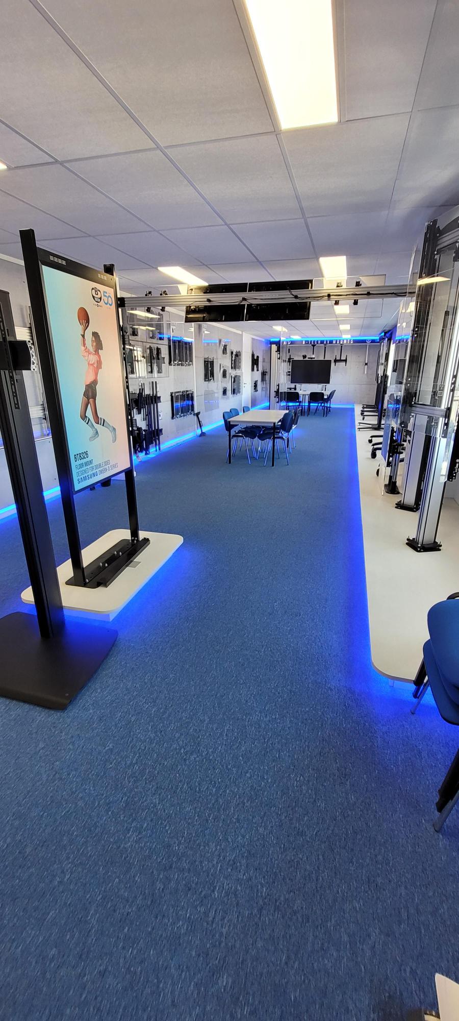 B-Tech Belgium product showroom featuring AV mounting solutions, digital signage displays and collaboration
