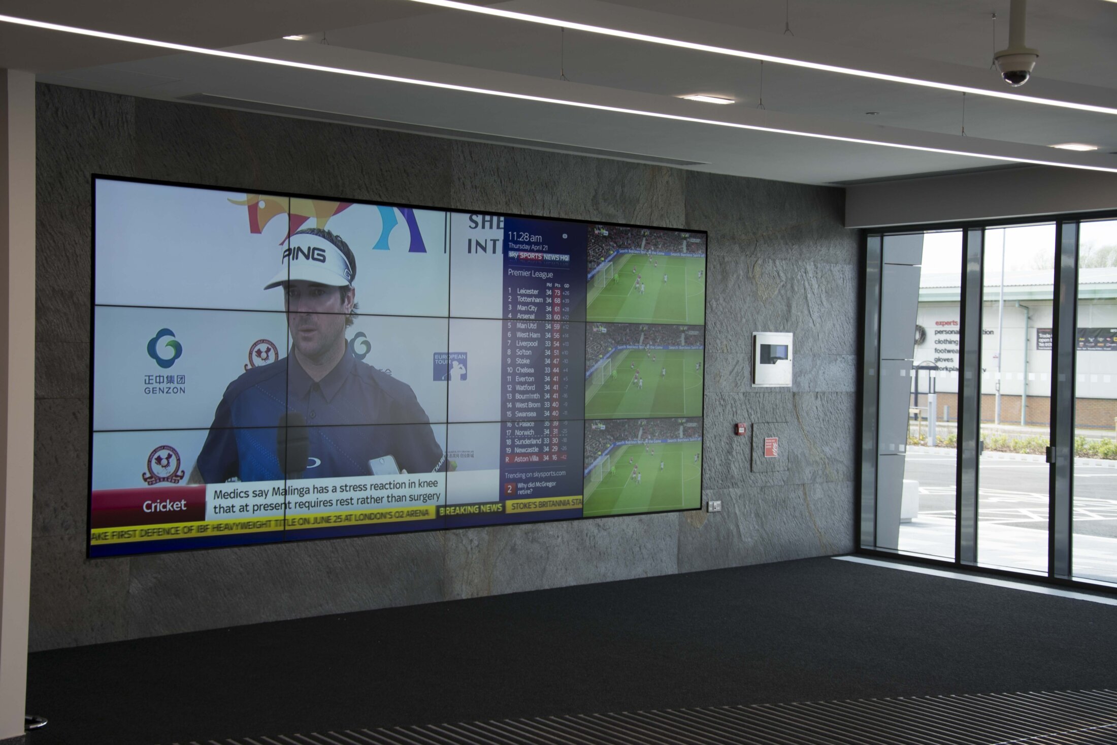 Large multi-screen display showing live broadcast and sports information at bet365 headquarters