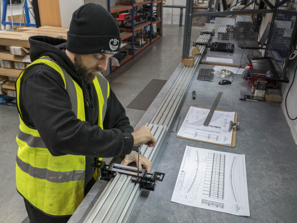 Technician installing AV equipment at Future Stores in London