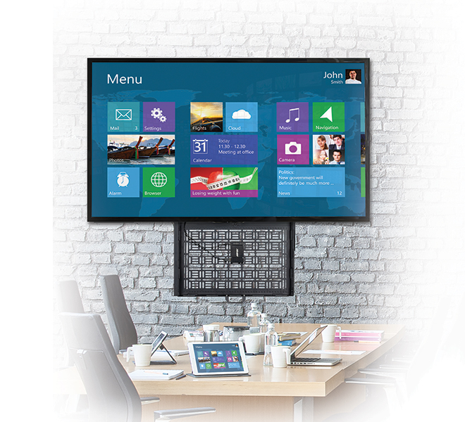 An Image of a BT7885 Flat Screen Wall Mount With Integrated Pull Out Storage Tray in an office setting
